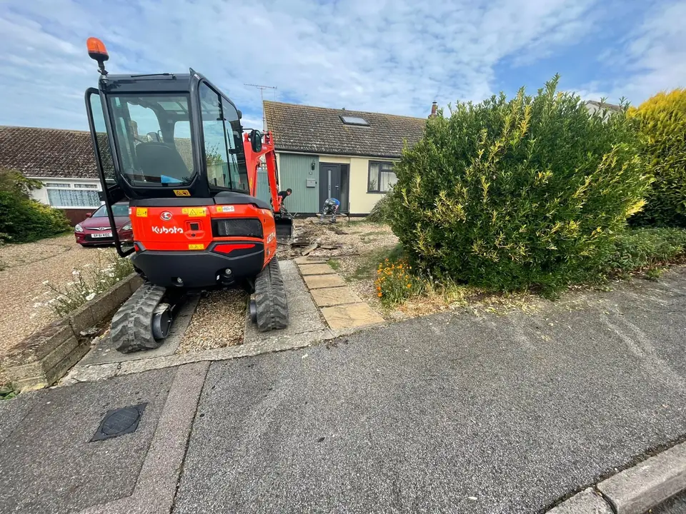 Excavator preparing the ground for a driveway