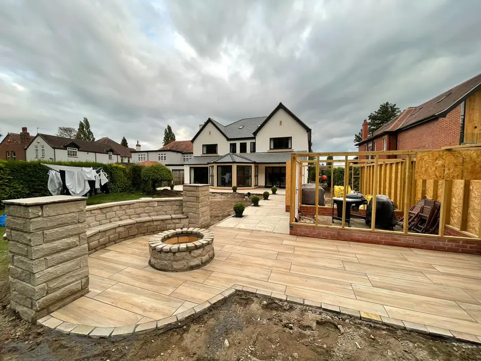 Patio layout with porcelain-style paving and garden seating